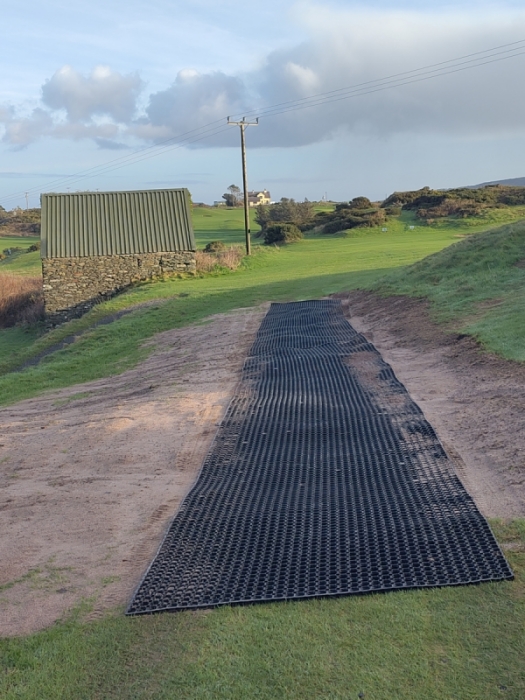 Rubber mats at the top of the approach to the 7th green.
